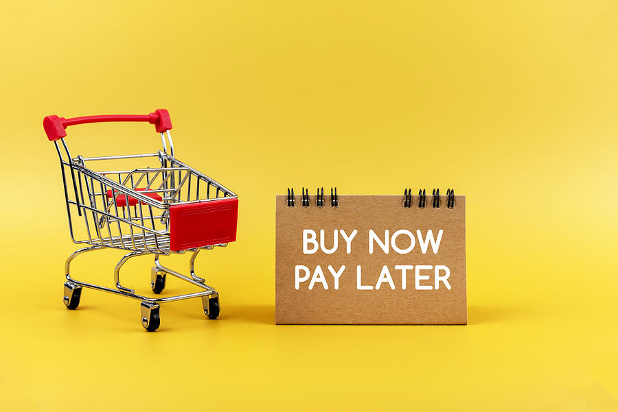Buy Now Pay Later Sign on Yellow Background Photograph by Nora Carol Photography