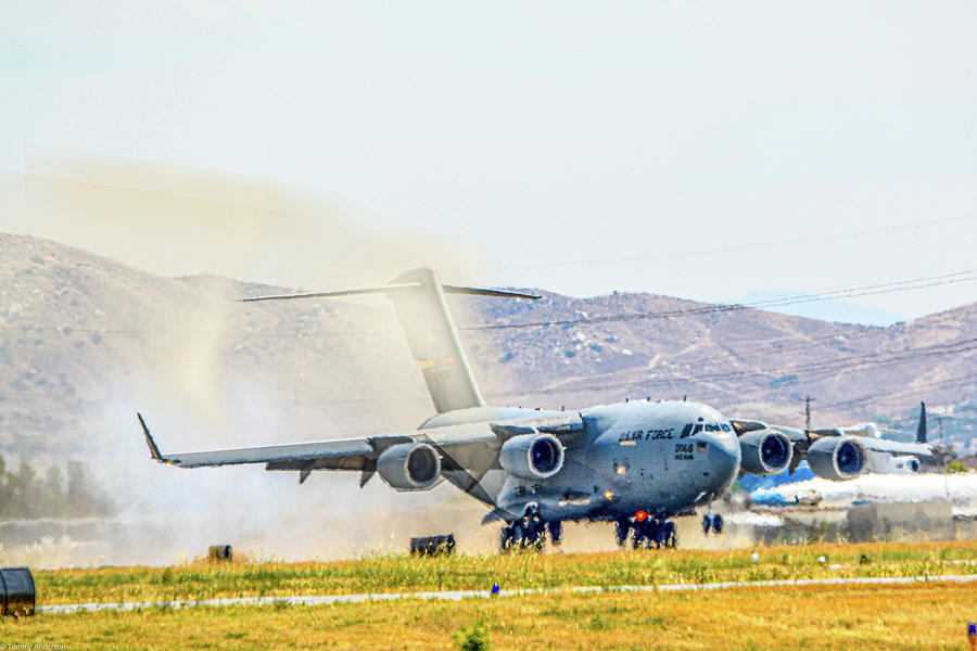 C-17 Dusty Landing Photograph by Tommy Anderson