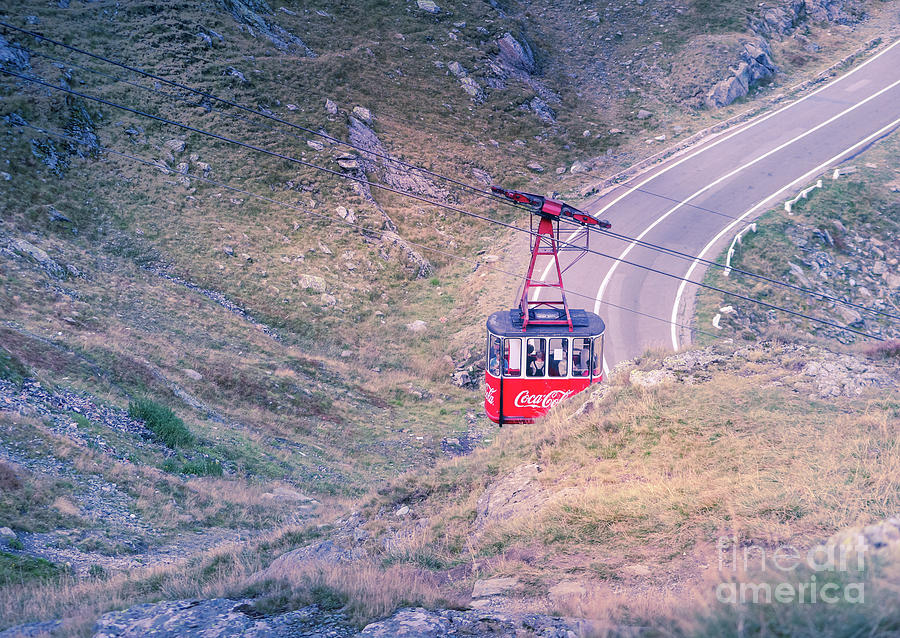 Cable car over mountain road Photograph by Claudia M Photography