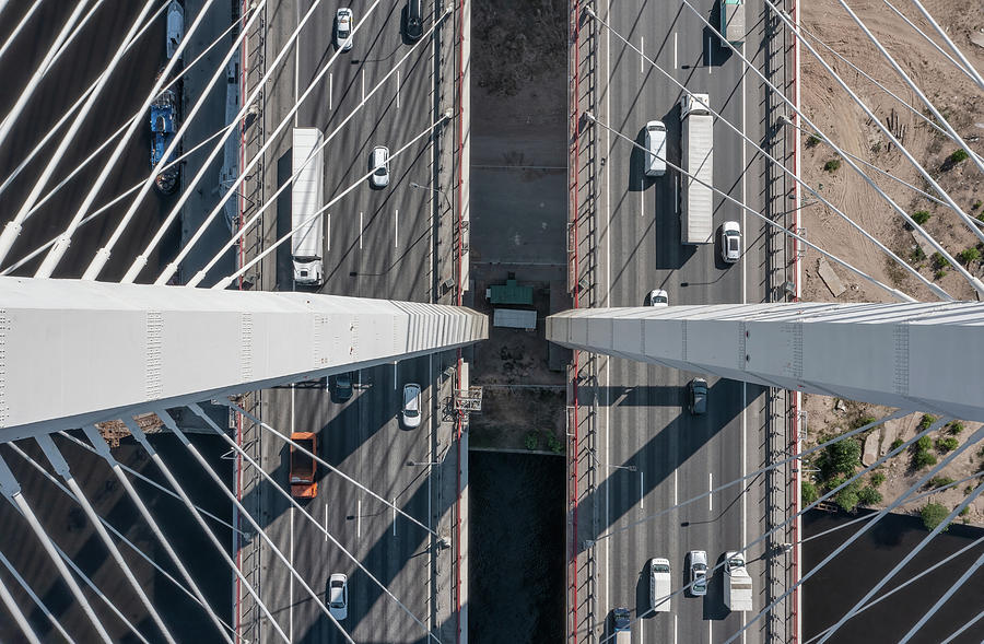 Cable-stayed bridge with cars Photograph by Mikhail Kokhanchikov