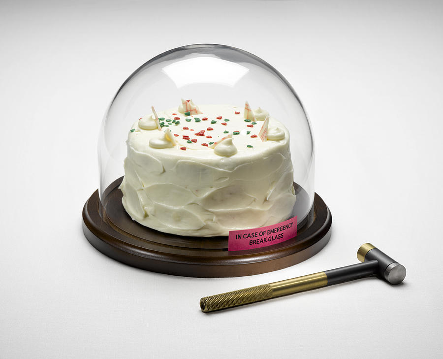 Cake Under Glass WIth Hammer Photograph by Jeffrey Coolidge