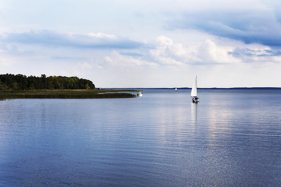 Calm lake and sailboat Photograph by Maciej Frolow