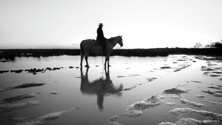 Camargue rancher at dawn Photograph by Jean Gill