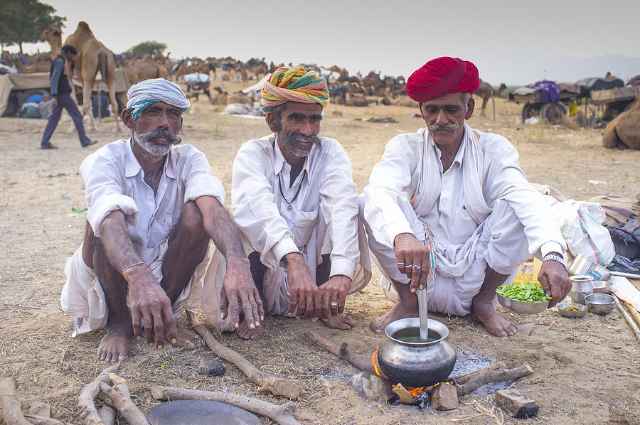 Camel traders cooking, Pushkar Camel Fair, India Photograph by Mike Powles