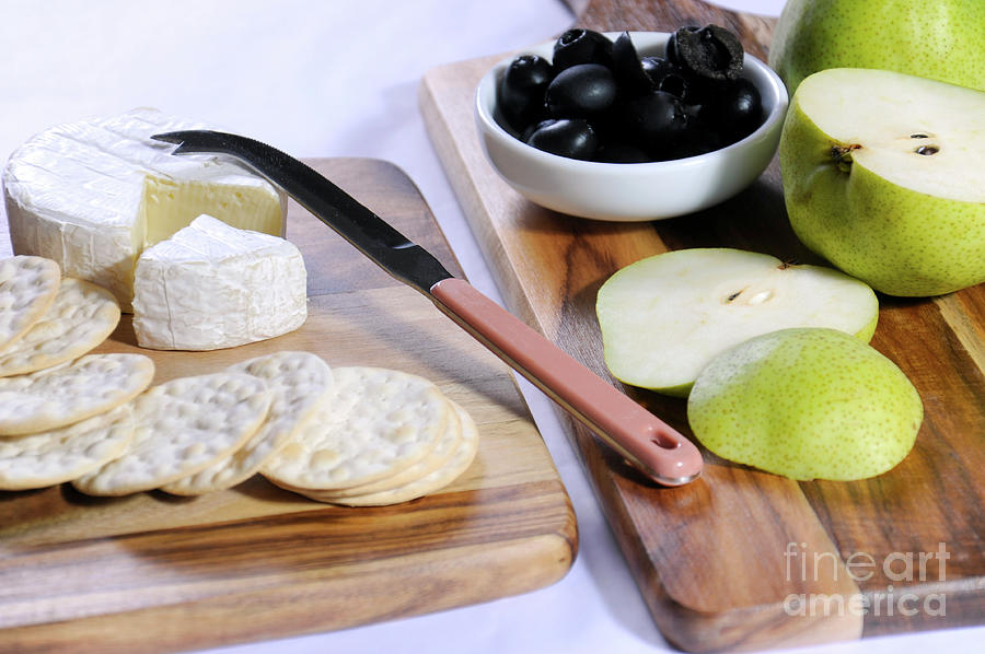 Camembert cheese with pears and olives Photograph by Milleflore Images