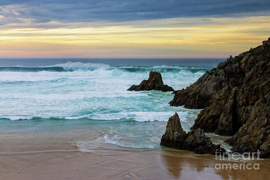 Campelo Beach at Dusk under Dramatic Yellow and Blue Sky Ferrol La Coruna Galicia Photograph by Pablo Avanzini