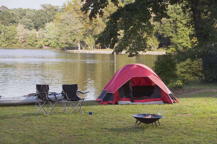 Campsite by lake Photograph by Comstock Images