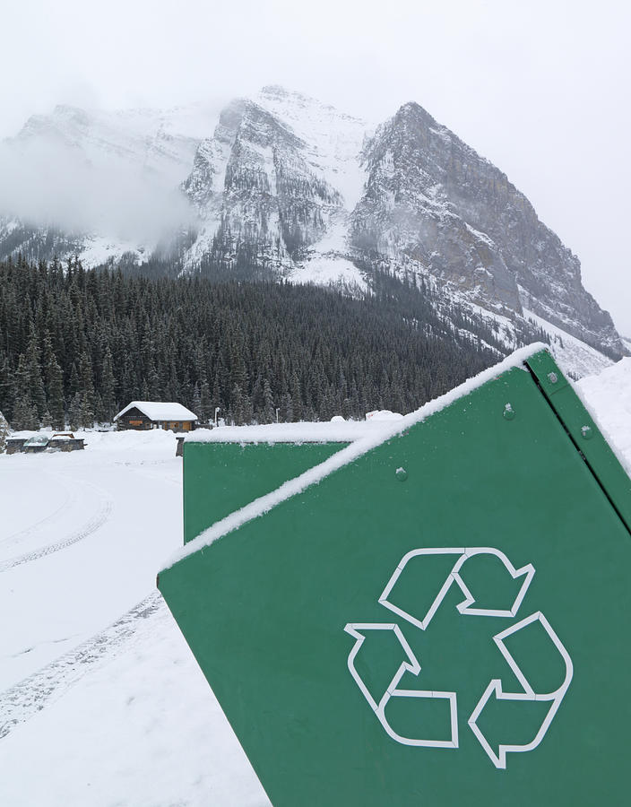 Canada, Alberta, Banff National Park, Recycling container, snow covered mountains in background Photograph by Ascent/PKS Media Inc.