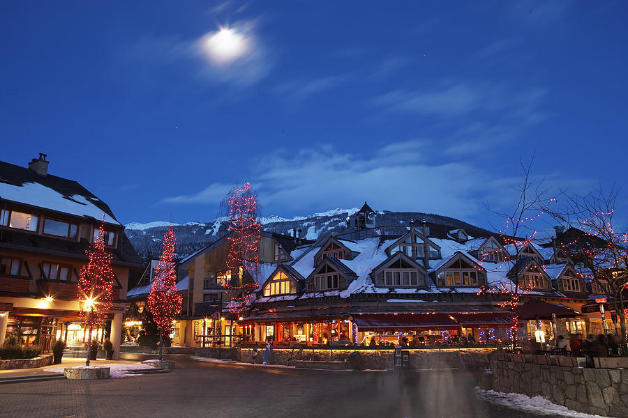 Canada, British Columbia, moon over Whistler Village at dusk Photograph by Thomas Northcut