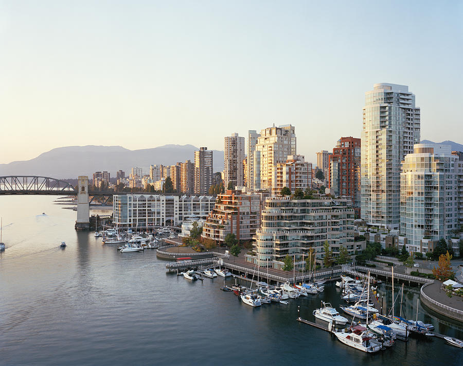 Canada, British Columbia, Vancouver, yachts moored in marina, city skyline in background Photograph by Raimund Koch