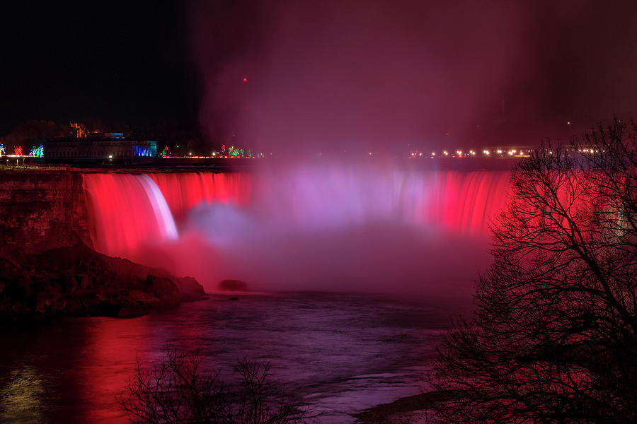 Canadian Falls at Niagara Lit in Red and White Photograph by John Twynam