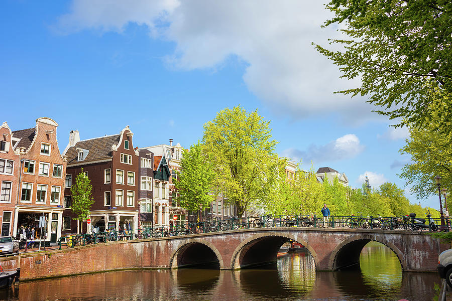 Canal and Bridge in City of Amsterdam Photograph by Artur Bogacki