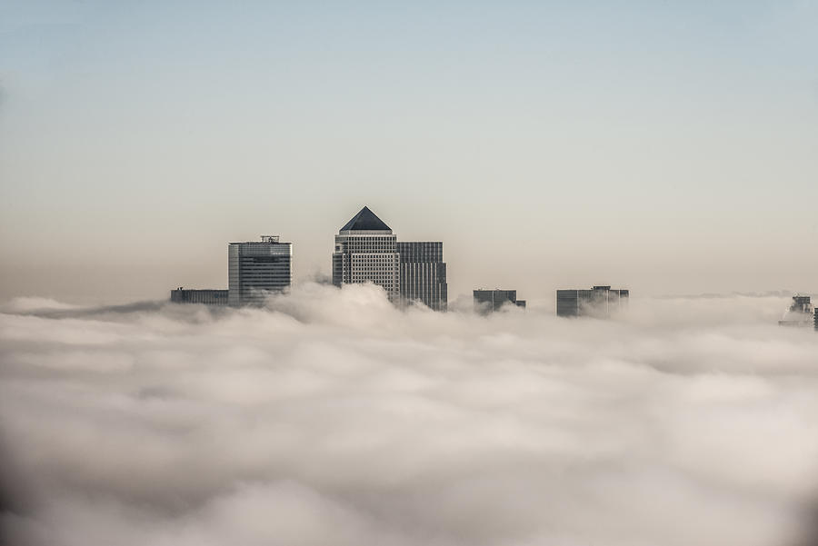 canary Wharf above the clouds Photograph by Howard Kingsnorth