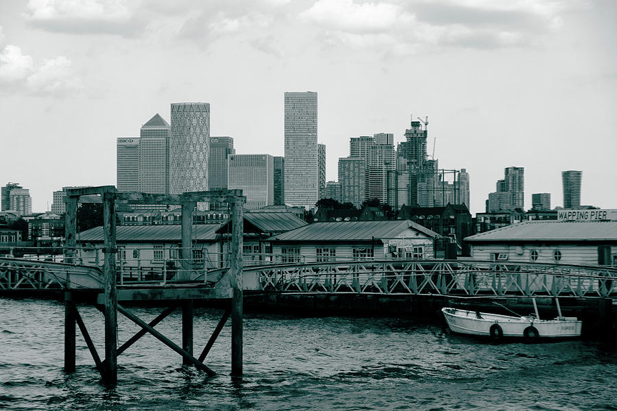 Canary Wharf view behind Wapping Pier in London Photograph by Iordanis Pallikaras