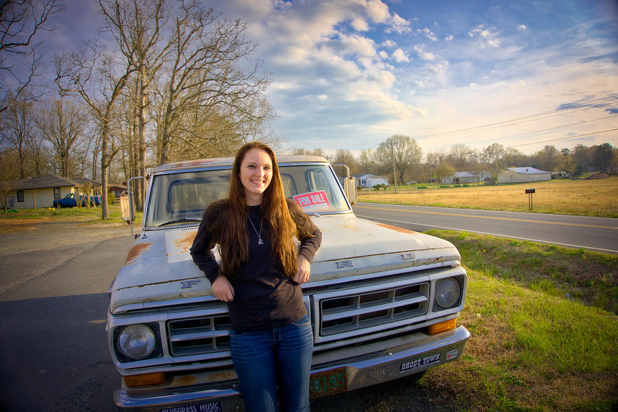 Candice leans against an old Ford truck at Kings Deli Photograph by Daniel Brinneman