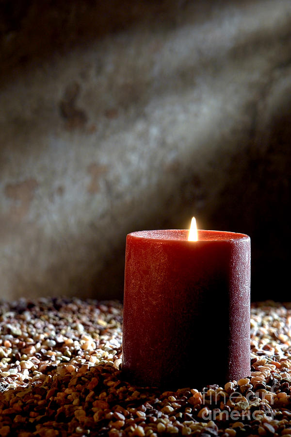 Candle Burning with Soft Glow Flame in Old House Photograph by Olivier Le Queinec