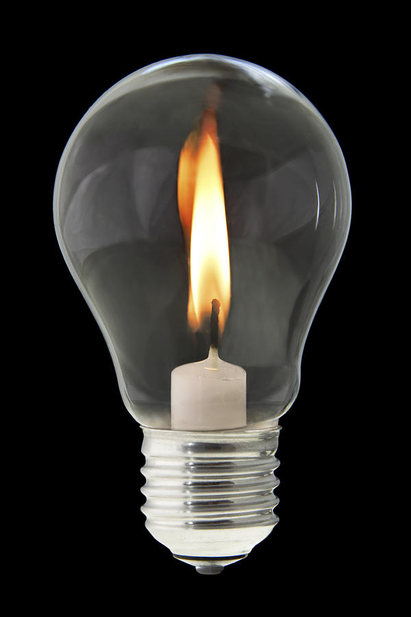 Candle Inside Light Bulb Photograph by Ideeone