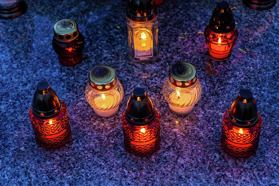 Candle Lights On Cemetery Grave Photograph by Artur Bogacki