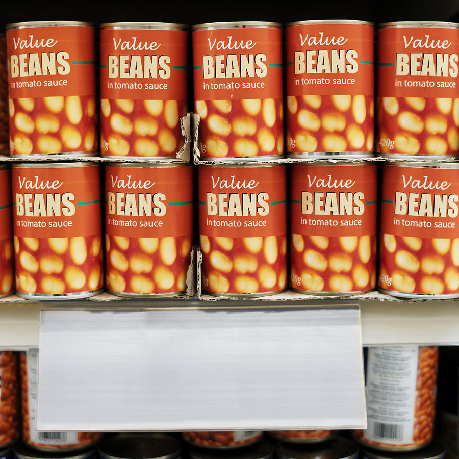 Canned Food Arranged In A Supermarket Photograph by George Doyle