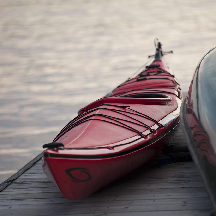 Canoe at a dock Photograph by Fotosearch