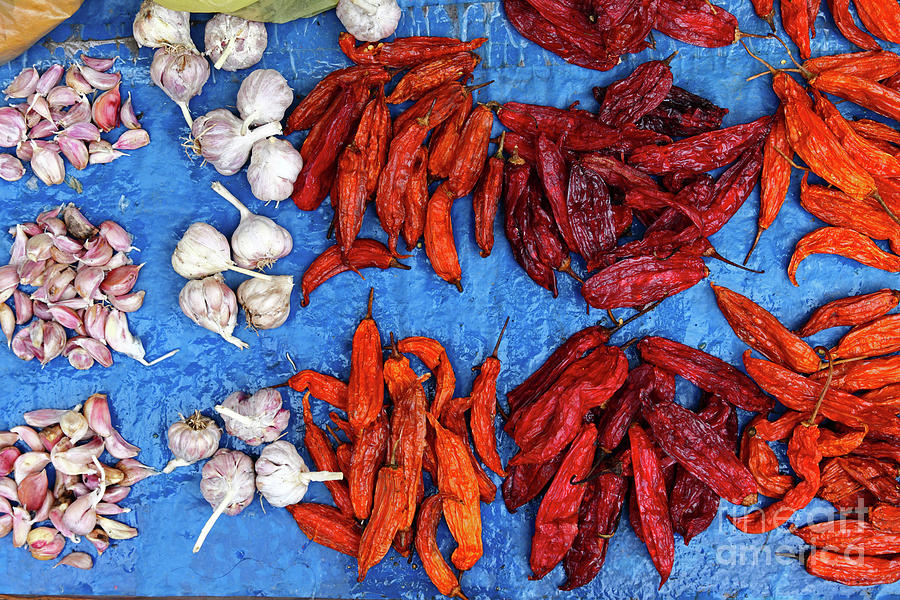 Capsicum baccatum chili peppers and garlic Photograph by James Brunker