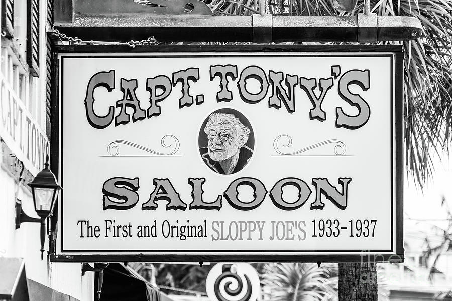 Black And White Photograph - Captain Tonys Saloon Sign Key West Black and White Photo by Paul Velgos