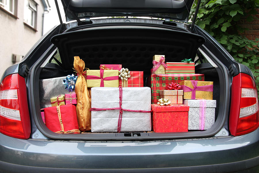Car boot filled with Christmas presents Photograph by SoopySue