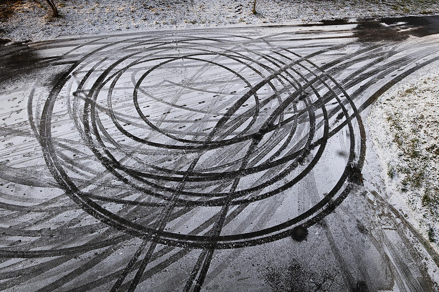Car Drift Skid Marks In Winter  Photograph by Artur Bogacki