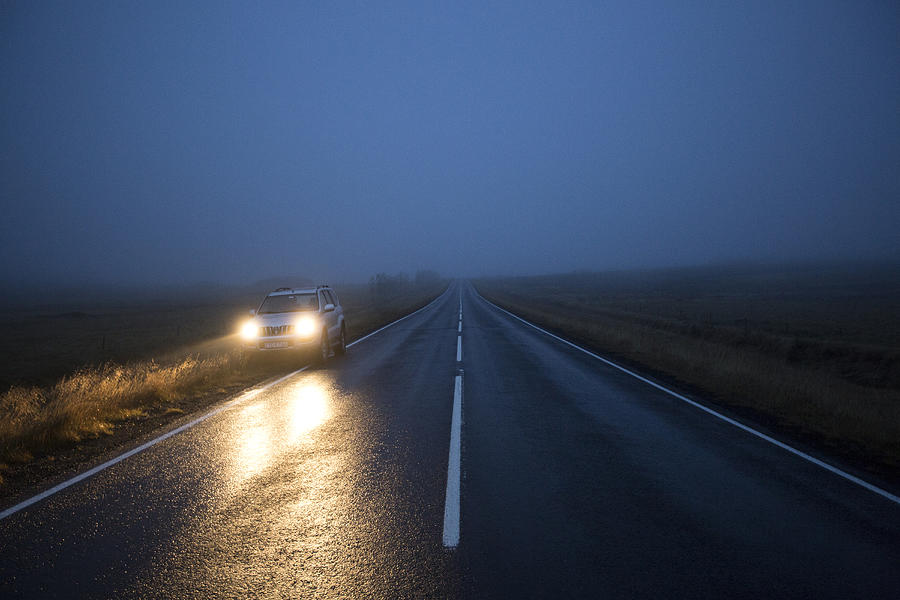 Car on remote road at night Photograph by Kyle Monk