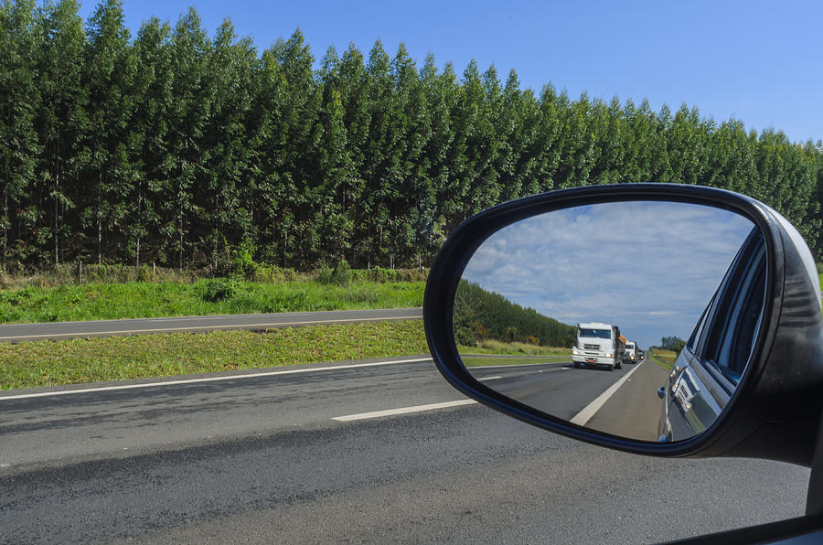 Car rearview mirror Photograph by Kcris Ramos