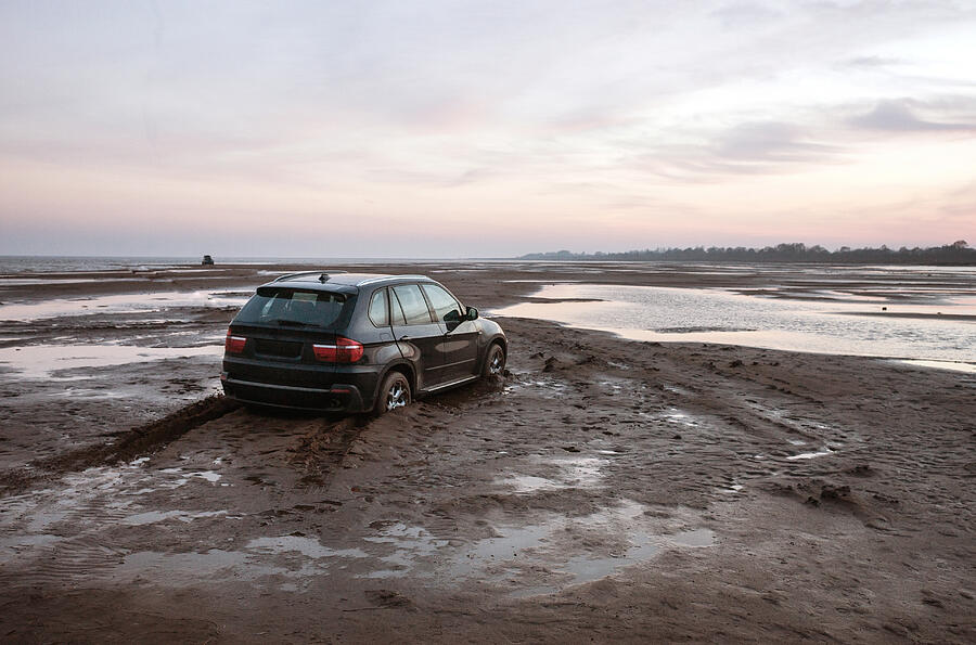 Car stuck in the mud Photograph by Hans Neleman