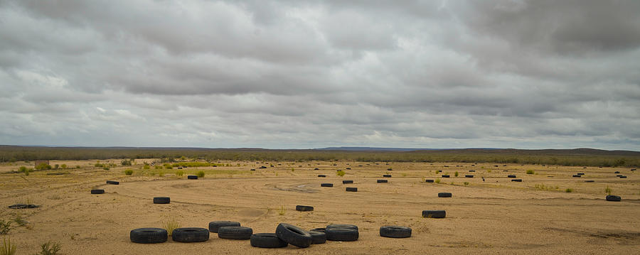 Car tires on landscape Photograph by Marcos Radicella