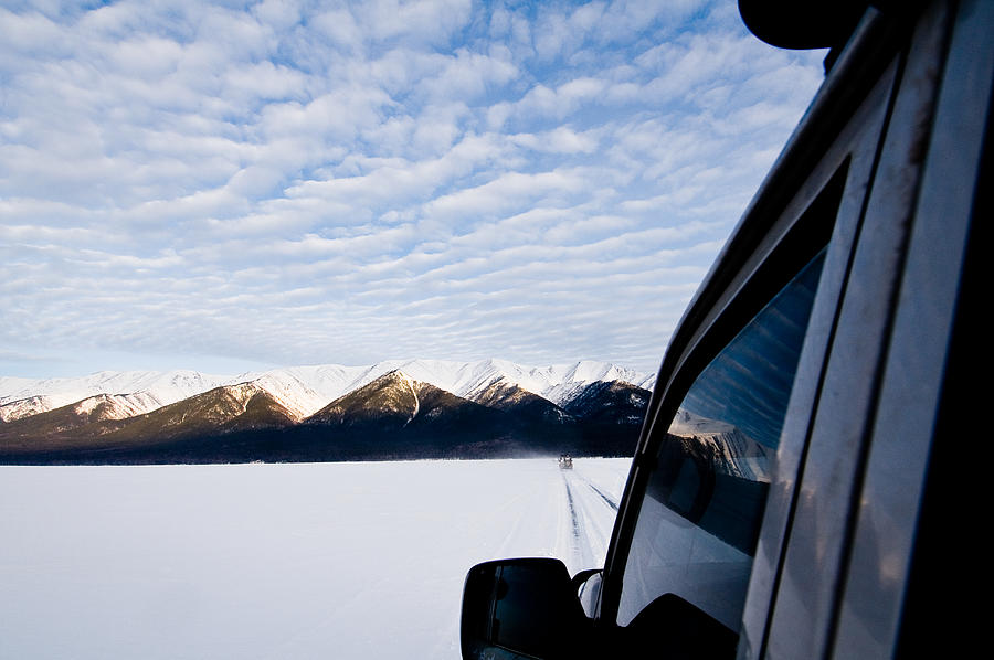 Car tracks and mountains viewed from a car window, Severobaykalsk, Russia Photograph by Hans Neleman