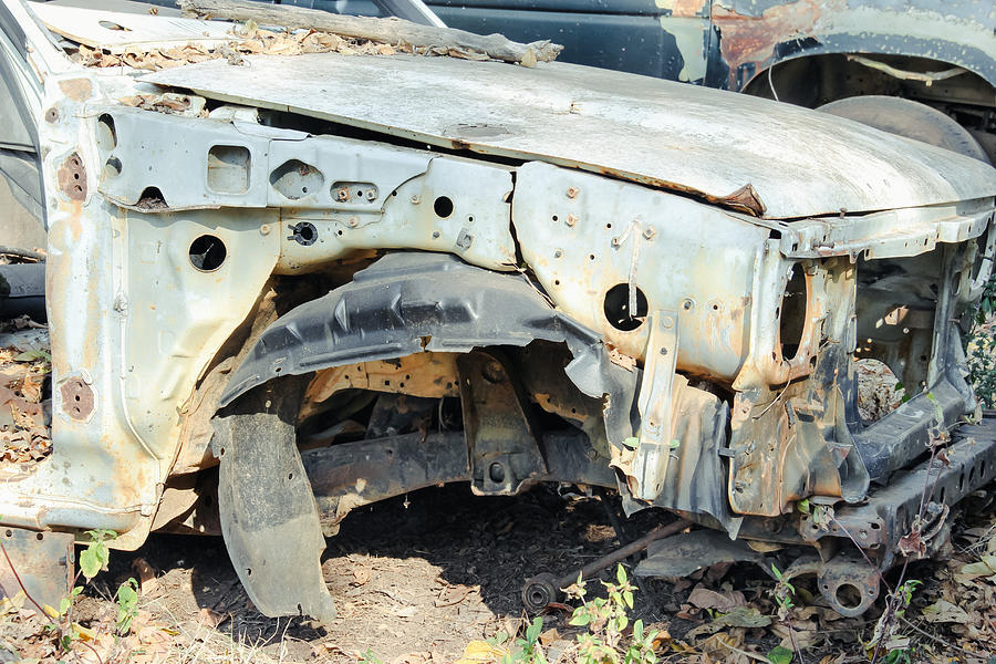Car Wreck At A Junkyard Photograph by Warat42