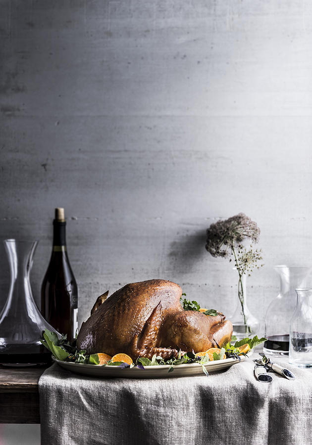 Carafe of wine on table with turkey Photograph by Manny Rodriguez
