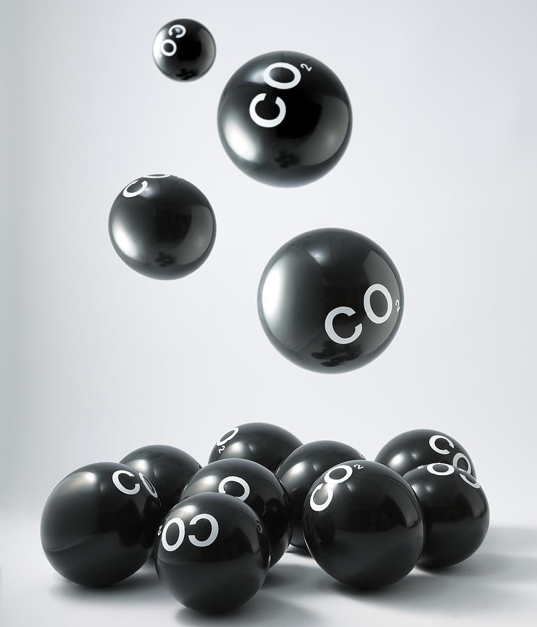 Carbon dioxide molecules falling into heap Photograph by Yasuhide Fumoto