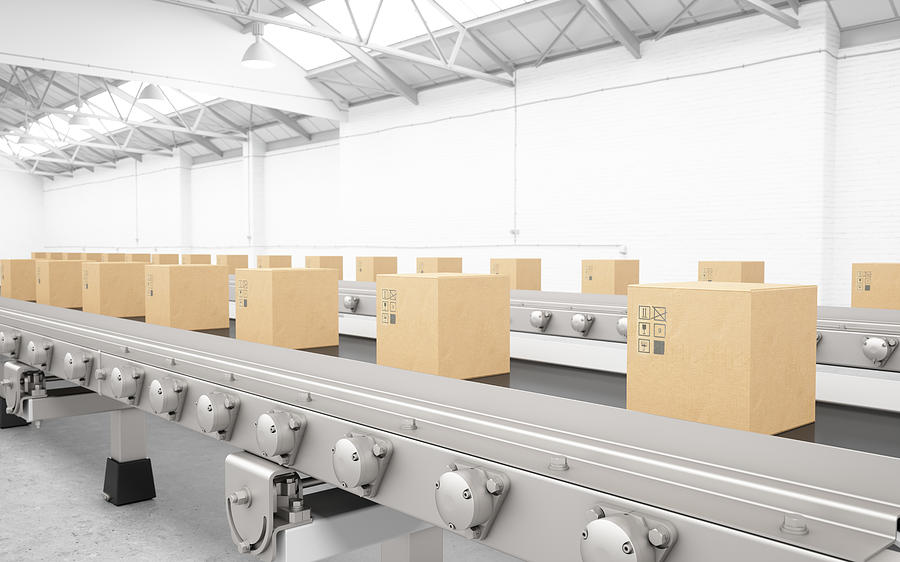 Cardboard boxes on conveyor belt Photograph by Onurdongel