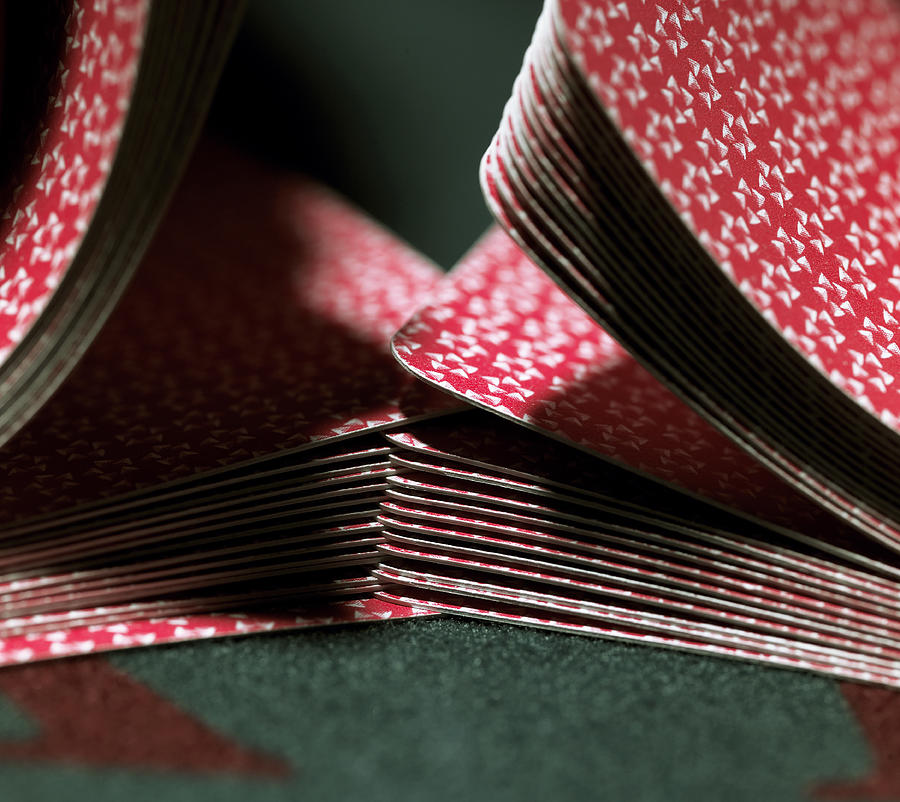 Cards being shuffled on gaming table, close-up Photograph by John Howard