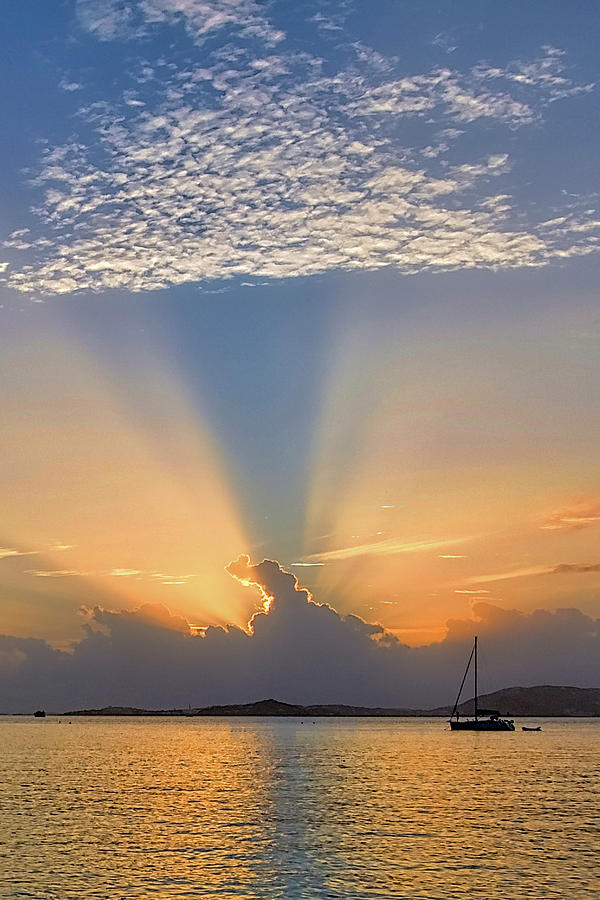 Caribbean Sunset Behind Clouds with Sailboat Photograph by Matthew DeGrushe