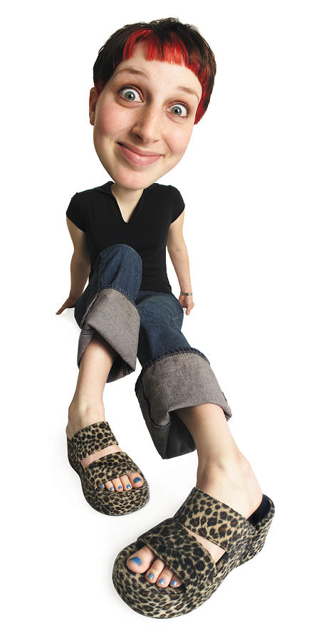Caricature Of Young Caucasian Woman In Jeans And Black Shirt Legs Outstretched Sitting And Smiling Photograph by Photodisc