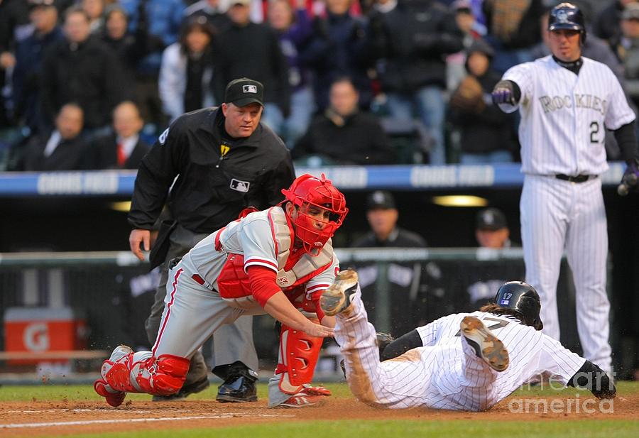 Carlos Ruiz and Todd Helton Photograph by Doug Pensinger