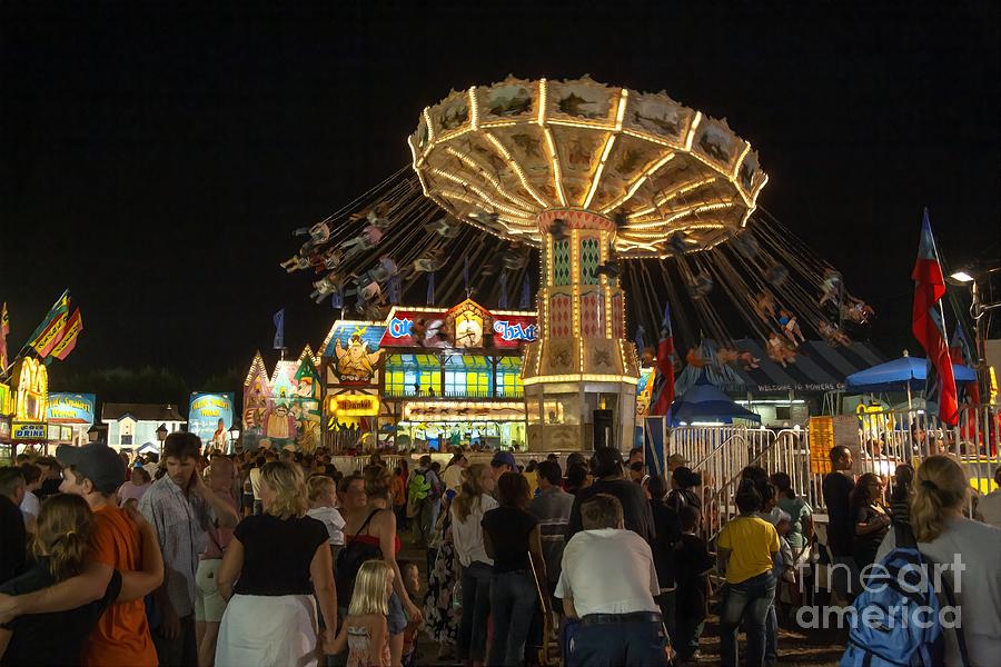 Carnival at night at a county fair in Maryland USA Photograph by