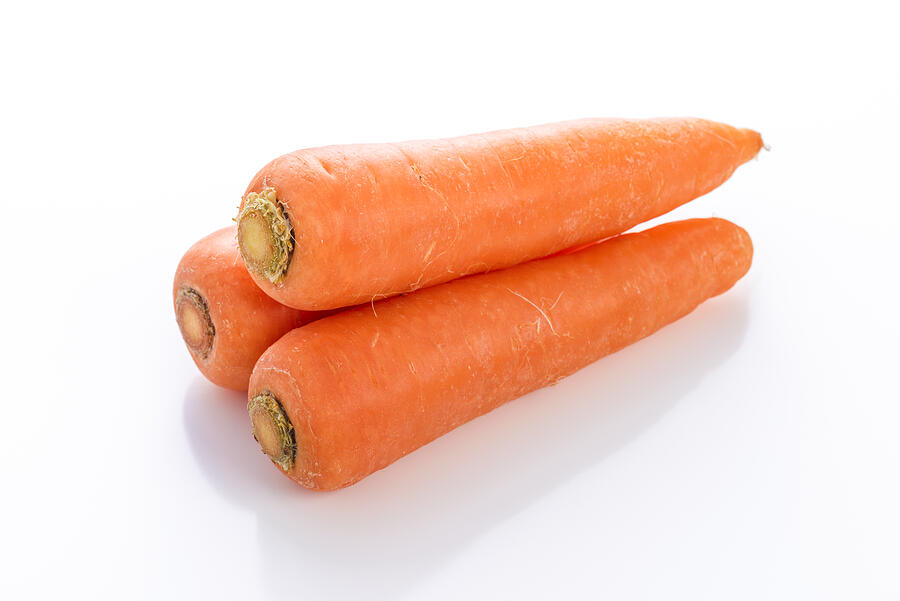 Carrot on white background Photograph by Kuppa_rock