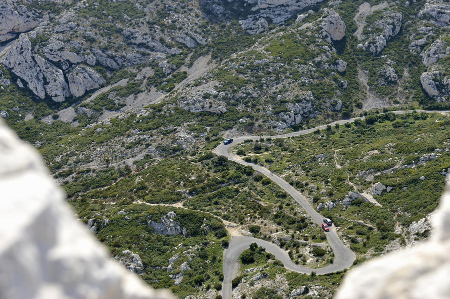 Cars on a winding road, calanques de Sormiou Photograph by Sami Sarkis