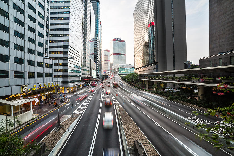 Cars rush in Hong Kong Central district Photograph by @ Didier Marti