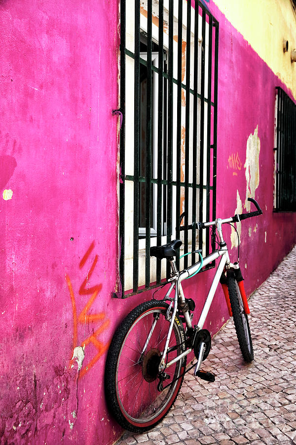Cascais Bike in the Pink Alley Photograph by John Rizzuto