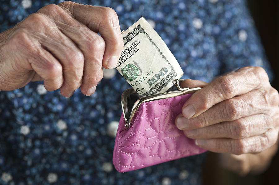 Cash and Elderly Hands Photograph by Klh49