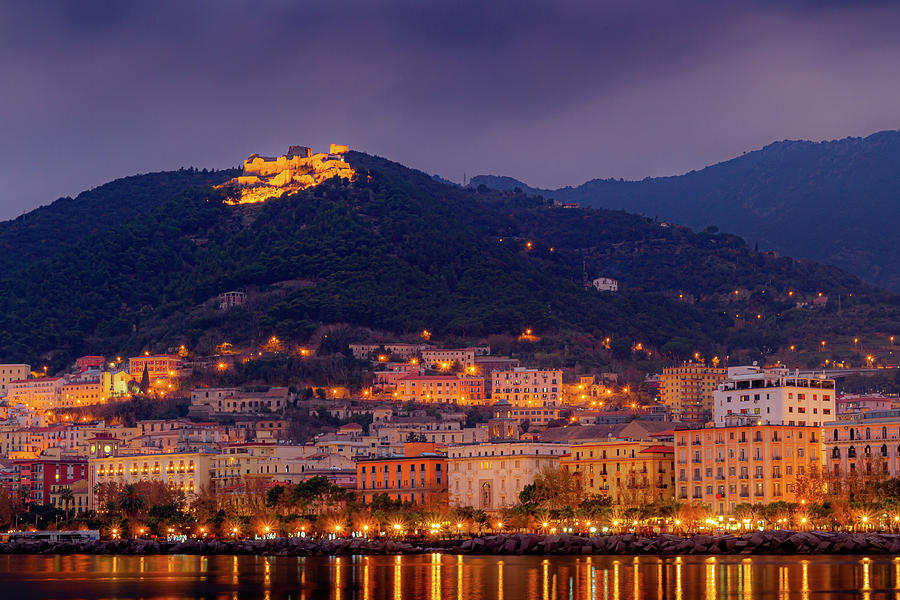 Castel above city on cloudy evening Photograph by Umberto Barone