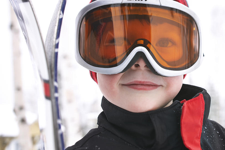 Caucasian boy wearing ski gear in snow Photograph by Janet Kimber
