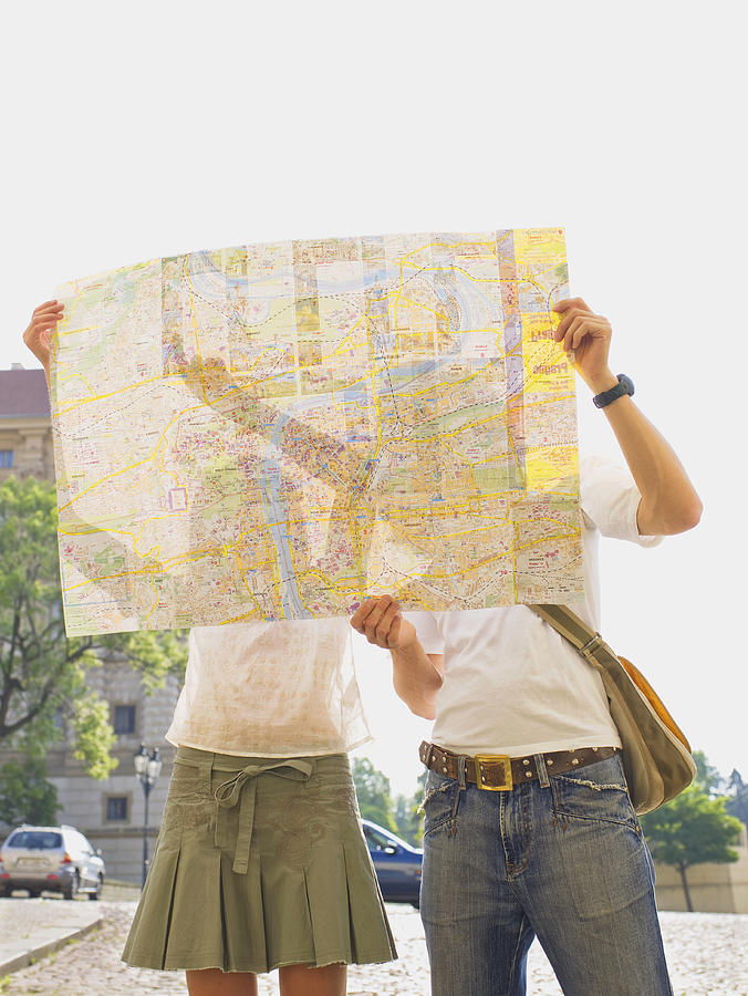 Caucasian couple reading city map outdoors Photograph by Jacobs Stock Photography Ltd